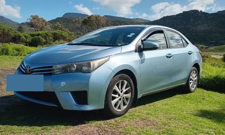 Light blue Toyota Corolla